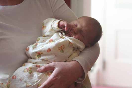Alastair, held by mom